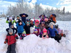kids on snow mound 